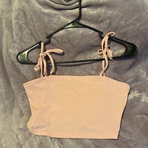 Light pink tank top. Available for discount bundle with other qualifying items!